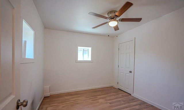 327/327.5 7th St, Walsenburg, CO 81089 - empty room with wood finished floors, ceiling fan, and baseboards
