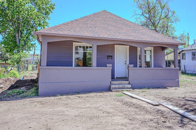 327/327.5 7th St, Walsenburg, CO 81089 - view of front facade featuring roof with shingles and a porch