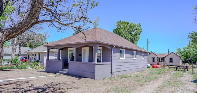 327/327.5 7th St, Walsenburg, CO 81089 - bungalow-style home featuring a shingled roof and covered porch