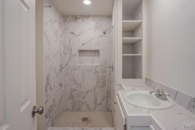 327/327.5 7th St, Walsenburg, CO 81089 - bathroom featuring tiled shower, vanity, and recessed lighting
