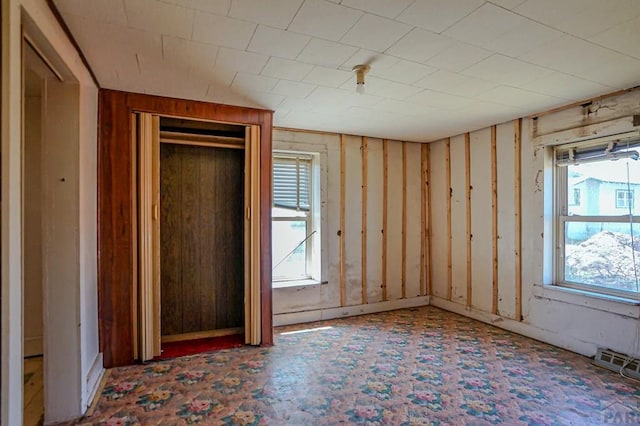 327/327.5 7th St, Walsenburg, CO 81089 - unfurnished bedroom featuring multiple windows