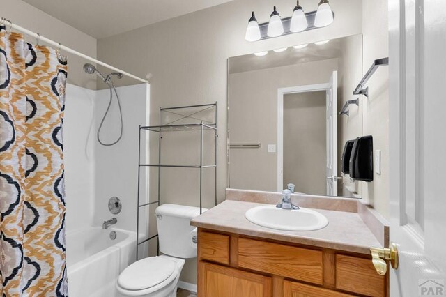 806 N Monarch Dr, Pueblo, CO 81007 - bathroom with shower / bath combination with curtain, vanity, and toilet