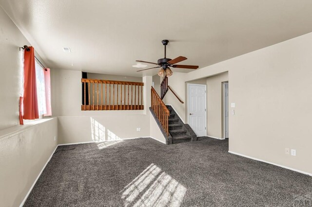 806 N Monarch Dr, Pueblo, CO 81007 - carpeted spare room featuring ceiling fan, baseboards, and stairs