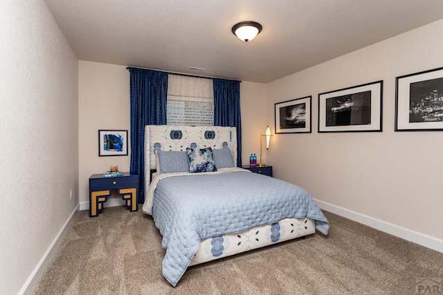 bedroom with baseboards and carpet flooring