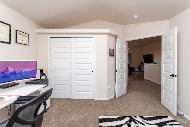 home office featuring lofted ceiling and carpet floors