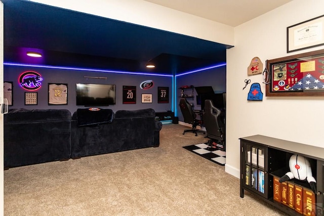 carpeted cinema featuring baseboards