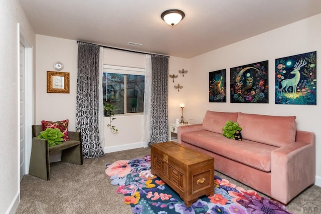 carpeted living room with baseboards