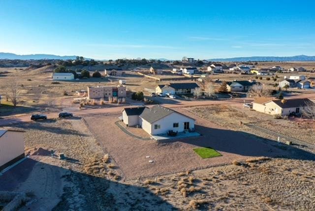 bird's eye view featuring a residential view and a mountain view