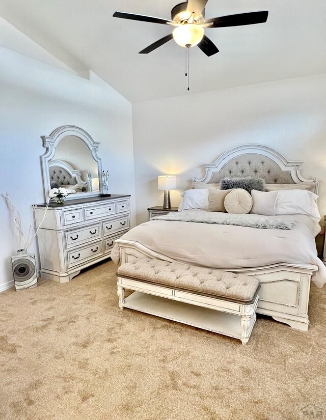 bedroom featuring ceiling fan, baseboards, and light colored carpet