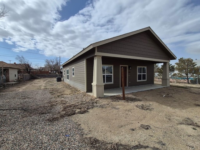 view of property exterior with a patio