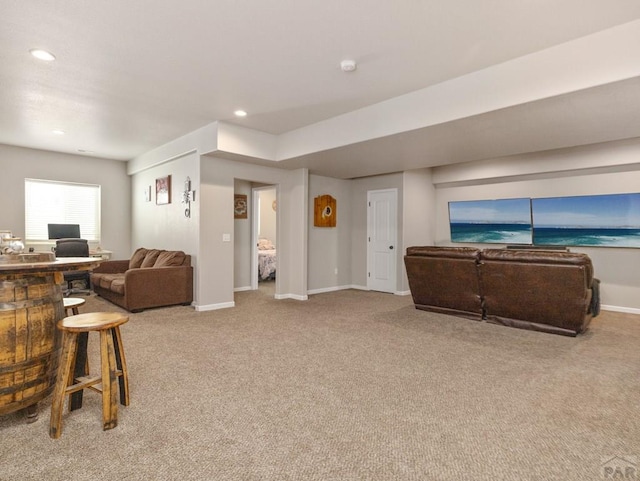 living room featuring carpet, baseboards, and recessed lighting