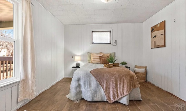 bedroom featuring wood finished floors