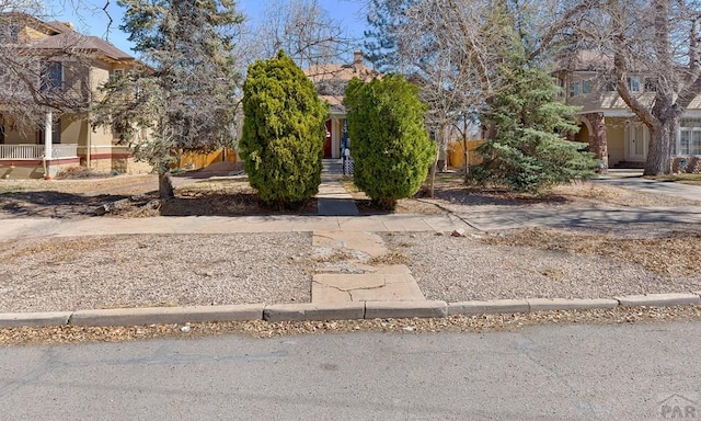 view of property hidden behind natural elements