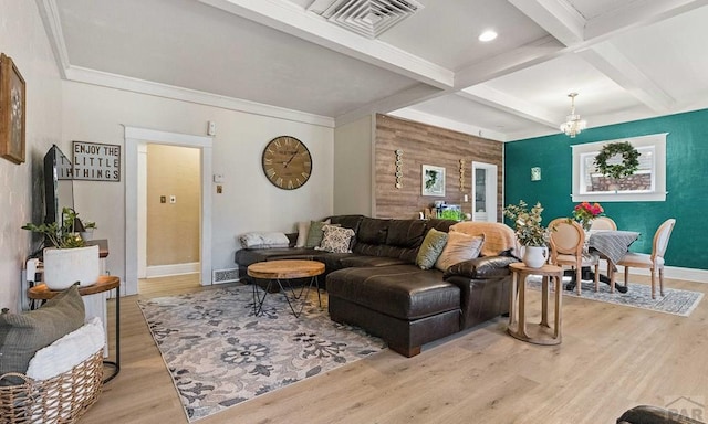 living area featuring visible vents, baseboards, beamed ceiling, light wood-style flooring, and coffered ceiling