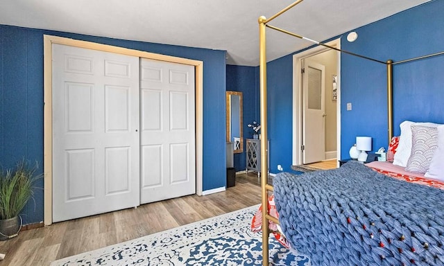 bedroom featuring a closet and wood finished floors