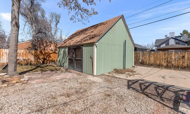 view of shed with a fenced backyard