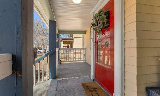 entrance to property featuring covered porch