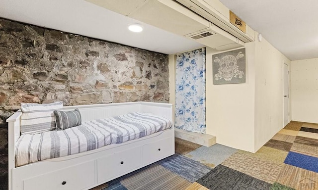 bedroom featuring visible vents and wainscoting