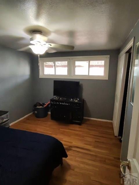 1622 Zuni Rd, Pueblo, CO 81001 - bedroom featuring wood finished floors, a ceiling fan, and baseboards