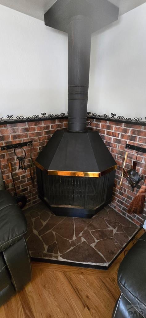 1622 Zuni Rd, Pueblo, CO 81001 - detailed view of a wood stove and wood finished floors