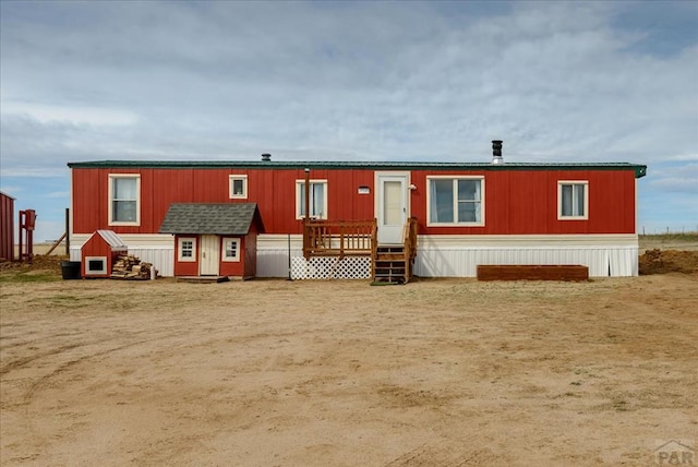 37155 E Jones Rd, Yoder, CO 80864 - manufactured / mobile home with an outbuilding and entry steps