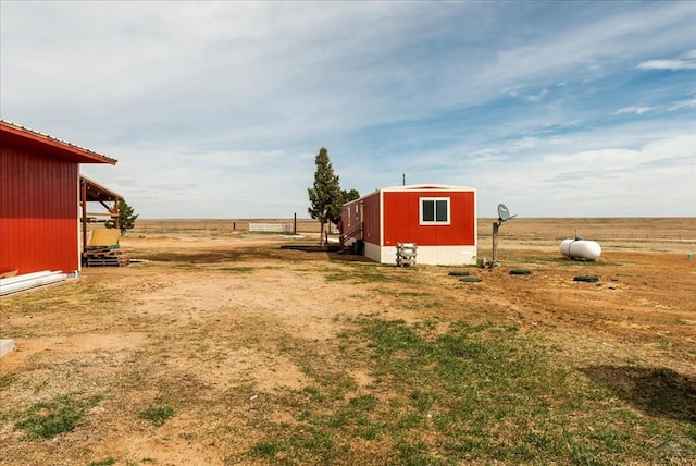 37155 E Jones Rd, Yoder, CO 80864 - view of yard featuring an outbuilding and a storage shed