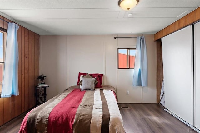 37155 E Jones Rd, Yoder, CO 80864 - bedroom featuring visible vents, wood finished floors, and multiple windows