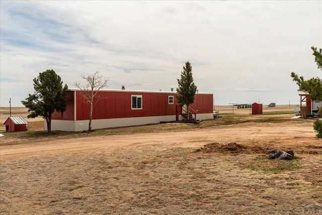37155 E Jones Rd, Yoder, CO 80864 - view of yard with an outdoor structure and an outbuilding