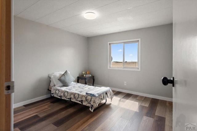 37155 E Jones Rd, Yoder, CO 80864 - bedroom featuring baseboards and wood finished floors
