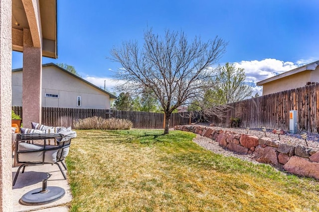 view of yard featuring a fenced backyard