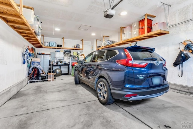 garage featuring a garage door opener