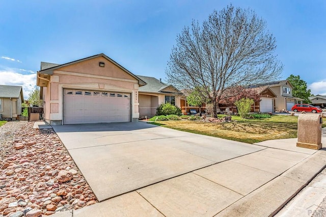 ranch-style house featuring a garage, stucco siding, and concrete driveway