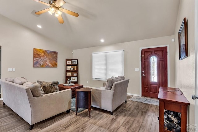 living room with recessed lighting, lofted ceiling, wood finished floors, baseboards, and ceiling fan