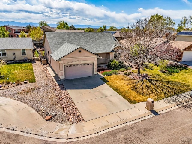 ranch-style house featuring driveway, an attached garage, stucco siding, roof with shingles, and a residential view