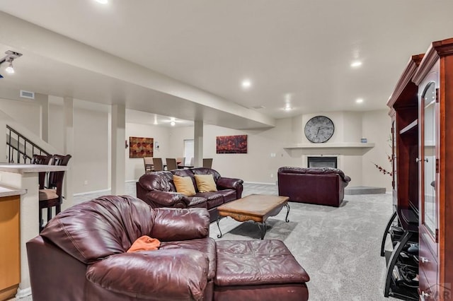 living room with recessed lighting, stairs, carpet flooring, and baseboards