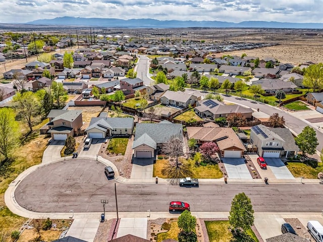 birds eye view of property with a residential view and a mountain view