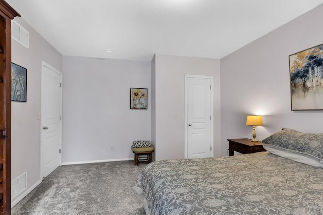 carpeted bedroom featuring visible vents and baseboards