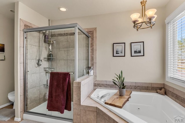 full bathroom with a chandelier, a shower stall, toilet, and a jetted tub