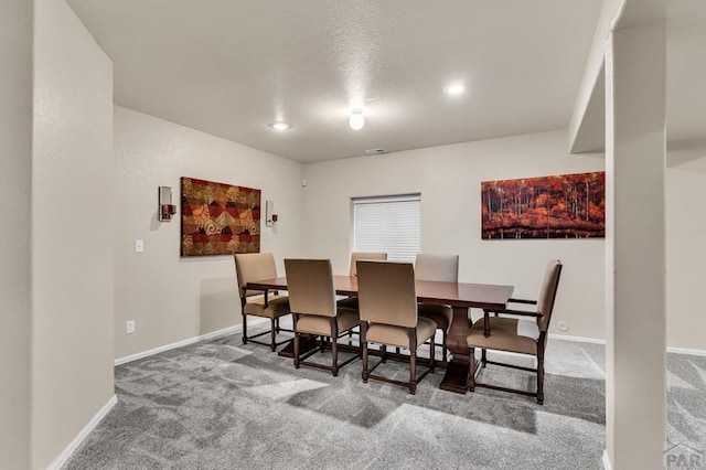 dining space with baseboards, carpet, and recessed lighting