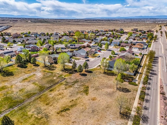 aerial view with a mountain view and a residential view