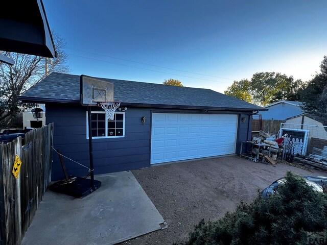 garage featuring fence