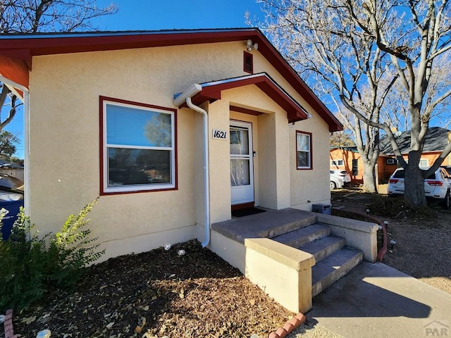 bungalow with stucco siding