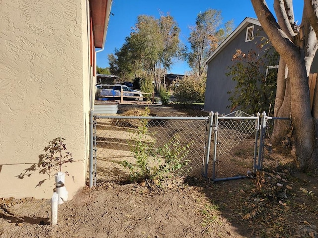 view of yard featuring a gate and fence