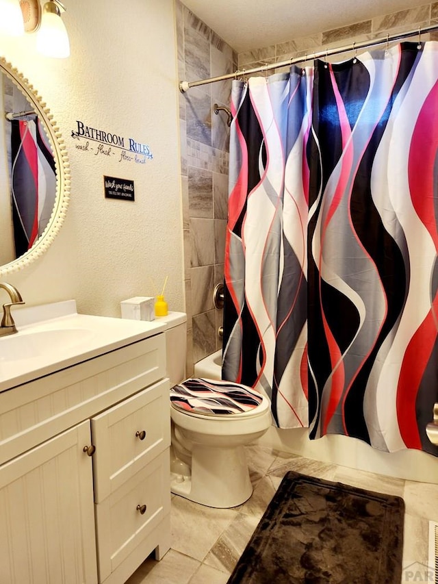 full bathroom featuring toilet, marble finish floor, vanity, and a shower with shower curtain