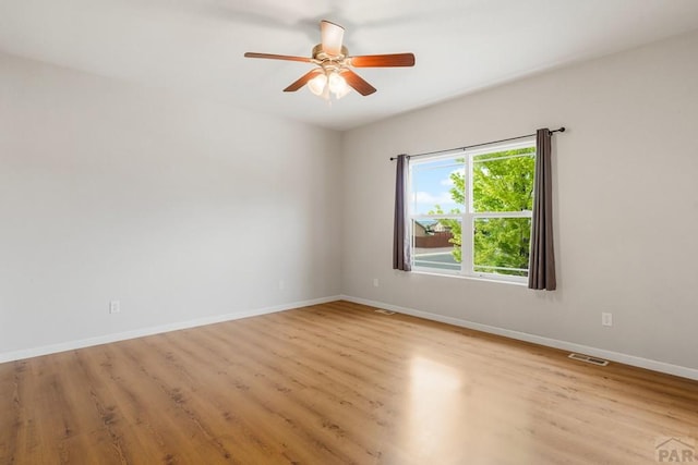 2330 Inspiration Ln, Pueblo, CO 81008 - spare room featuring ceiling fan, wood finished floors, and baseboards
