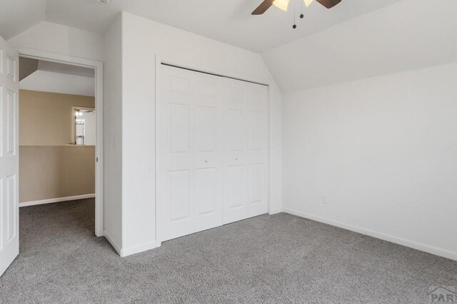 2330 Inspiration Ln, Pueblo, CO 81008 - unfurnished bedroom with carpet flooring, lofted ceiling, a closet, baseboards, and a ceiling fan