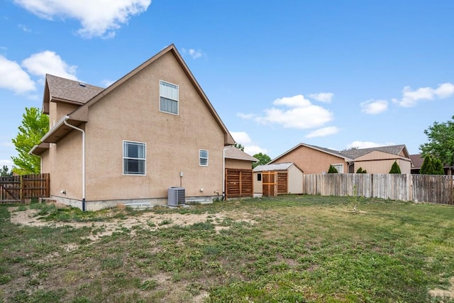 2330 Inspiration Ln, Pueblo, CO 81008 - rear view of property featuring stucco siding, a storage unit, and an outbuilding