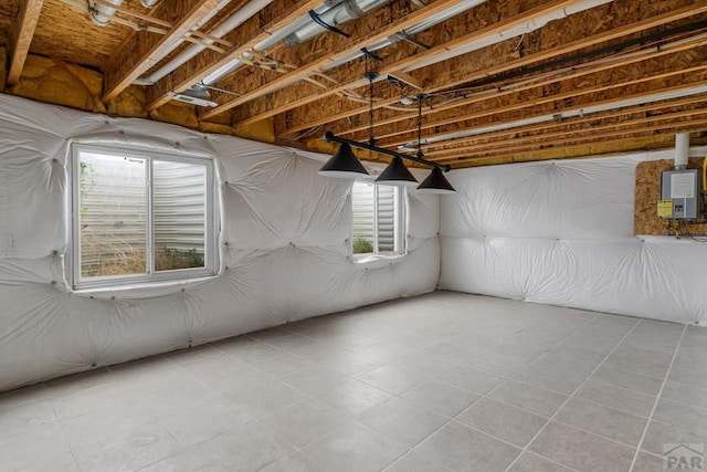 2330 Inspiration Ln, Pueblo, CO 81008 - below grade area featuring plenty of natural light, tile patterned floors, and electric panel
