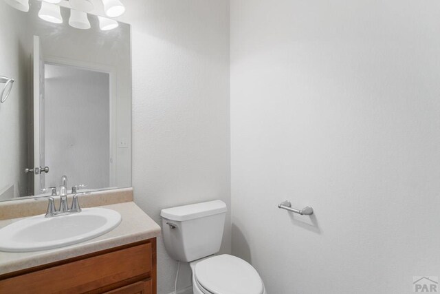 2330 Inspiration Ln, Pueblo, CO 81008 - half bath with toilet and vanity