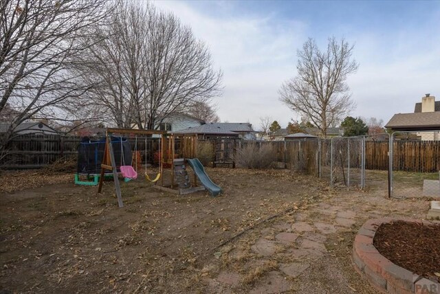 view of playground with a fenced backyard